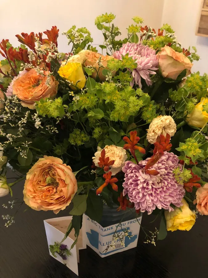 Lush seasonal bouquet delivered with a thank-you card